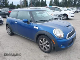 2007 MINI Hardtop S with VIN WMWMF73527TL91061, listed as a IAAI auction lot 41842104 with 65,259 mi miles and . Bid and sale history available at DreamBid. Image 1.