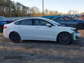 2018 Ford Fusion SE z VIN 3FA6P0H77JR108212, wystawiony jako IAAI lot #41208435 z przebiegiem 68 825 mil mil oraz . Historia ofert i sprzedaży dostępna na DreamBid. Obrazek 14.