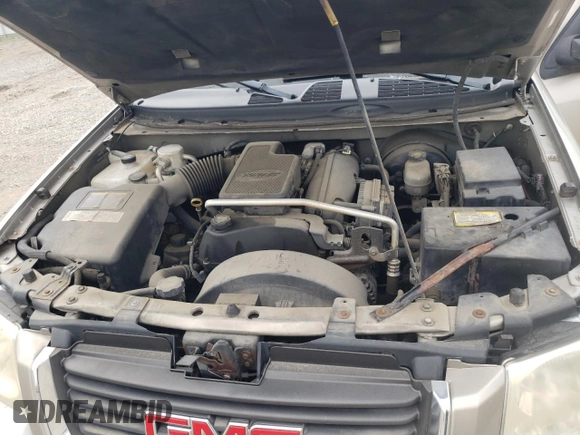 2003 GMC Envoy SLE z VIN 1GKDT13S332365071, wystawiony jako Copart lot #52811295 z przebiegiem Nie podano mil oraz Szkoda całkowita • Salvage title. Historia ofert i sprzedaży dostępna na DreamBid. Obrazek 13.