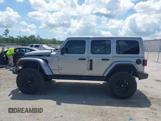 2021 Jeep Wrangler Unlimited Sahara with VIN 1C4HJXEN9MW637288, listed as a IAAI auction lot 42553459 with 39,362 mi miles and . Bid and sale history available at DreamBid. Image 14.