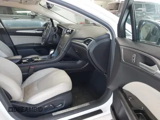 2016 Ford Fusion Titanium with VIN 3FA6P0K96GR390989, listed as a IAAI auction lot 42634275 with 123,559 mi miles and . Bid and sale history available at DreamBid. Image 5.