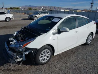 2021 Toyota Prius L Eco with VIN JTDKAMFU9M3150667, listed as a IAAI auction lot 41609328 with 59,177 mi miles. Bid and sale history available at carsss.com. Image 18.