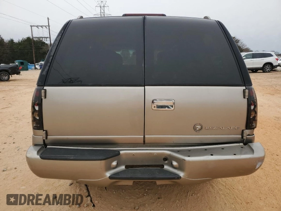 2000 Cadillac Escalade z VIN 1GYEK63R9YR218680, wystawiony jako Copart lot #87393204 z przebiegiem 295 494 mil mil oraz Szkoda całkowita • Salvage title. Historia ofert i sprzedaży dostępna na DreamBid. Obrazek 6.
