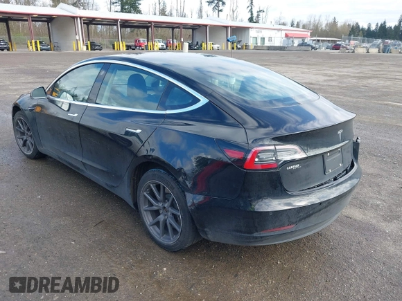 2019 Tesla Model 3 Mid Range with VIN 5YJ3E1EA4KF305611, listed as a IAAI auction lot 41916738 with 59,101 mi miles and . Bid and sale history available at carsss.com. Image 3.