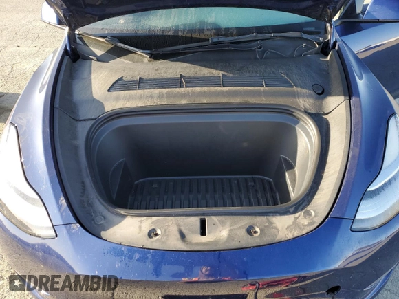 2022 Tesla Model Y Long Range z VIN 7SAYGDEE4NF408202, wystawiony jako Copart lot #51790905 z przebiegiem 43 509 mil mil oraz Szkody całkowita. Historia ofert i sprzedaży dostępna na DreamBid. Obrazek 13.
