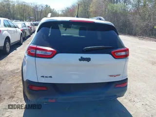 2014 Jeep Cherokee Trailhawk with VIN 1C4PJMBS8EW163212, listed as a IAAI auction lot 42124107 with 114,999 mi miles. Bid and sale history available at carsss.com. Image 16.