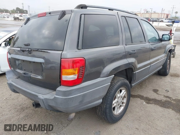 2004 Jeep Grand Cherokee Laredo with VIN 1J4GX48S34C214485, listed as a IAAI auction lot 42208120 with 164,322 mi miles and . Bid and sale history available at DreamBid. Image 4.
