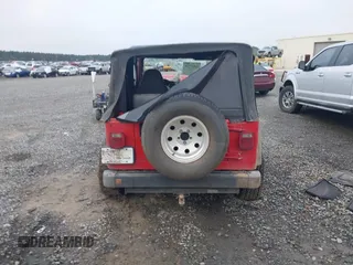 1997 Jeep Wrangler Sport z VIN 1J4FY19S2VP426553, wystawiony jako IAAI lot #41917764 z przebiegiem 154 140 mil mil oraz . Historia ofert i sprzedaży dostępna na DreamBid. Obrazek 16.
