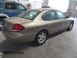 2006 Ford Taurus SE with VIN 1FAFP53U46A123827, listed as a IAAI auction lot 42042946 with 146,393 mi miles. Bid and sale history available at carsss.com. Image 4.