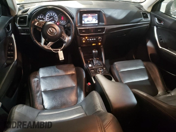 2016 Mazda CX-5 Grand Touring with VIN JM3KE4DY6G0655802, listed as a Copart auction lot 43820475 with 76,639 mi miles and Salvage Title. Bid and sale history available at carsss.com. Image 8.