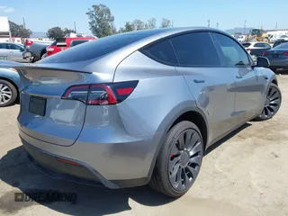 2024 Tesla Model Y Performance with VIN 7SAYGDEF9RA299036, listed as a IAAI auction lot 42140788 with 14,844 mi miles and . Bid and sale history available at DreamBid. Image 4.