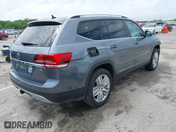 2019 Volkswagen Atlas SE z VIN 1V2WR2CAXKC611864, wystawiony jako IAAI lot #42151795 z przebiegiem 90 178 mil mil oraz . Historia ofert i sprzedaży dostępna na DreamBid. Obrazek 4.