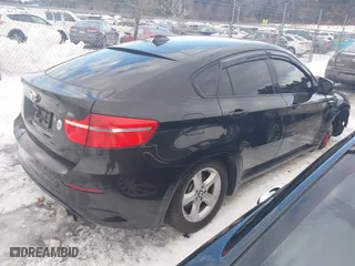 2011 BMW X6 M with VIN 5YMGZ0C57BLK14388, listed as a IAAI auction lot 41411854 with 129,248 mi miles. Bid and sale history available at carsss.com. Image 4.