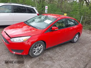 2016 Ford Focus SE z VIN 1FADP3F23GL285640, wystawiony jako IAAI lot #42066370 z przebiegiem 97 007 mil mil oraz . Historia ofert i sprzedaży dostępna na DreamBid. Obrazek 2.