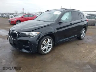 2021 BMW X1 xDrive28i with VIN WBXJG9C01M3M71033, listed as a IAAI auction lot 41723970 with 71,000 mi miles. Bid and sale history available at carsss.com. Image 17.