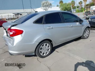 2012 Ford Fiesta SE with VIN 3FADP4BJ2CM150953, listed as a IAAI auction lot 42010904 with 77,637 mi miles. Bid and sale history available at carsss.com. Image 4.