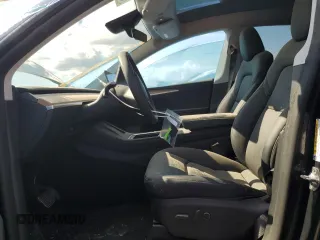 2024 Tesla Model Y с VIN 7SAYGDED4RA329638, выставлен на аукционе Copart как лот 54562525 с пробегом 8 606 миль миль и Списание • Salvage title. История ставок и продаж доступна на DreamBid. Изображение 7.
