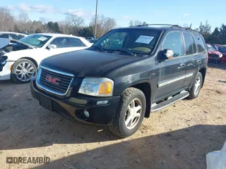 2002 GMC Envoy SLT with VIN 1GKDS13SX22440026, listed as a IAAI auction lot 41716249 with 179,141 mi miles. Bid and sale history available at carsss.com. Image 2.