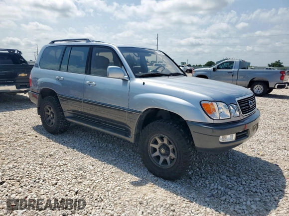 2001 Lexus LX 470 z VIN JTJHT00W313504330, wystawiony jako Copart lot #61126435 z przebiegiem 87 049 mil mil oraz Czysty tytuł • Clean title. Historia ofert i sprzedaży dostępna na DreamBid. Obrazek 4.