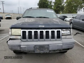 1998 Jeep Grand Cherokee Laredo with VIN 1J4FX58S0WC305329, listed as a Copart auction lot 76777264 with 251,942 mi miles and Clean Title. Bid and sale history available at carsss.com. Image 5.
