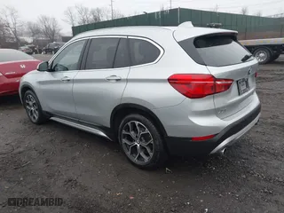 2021 BMW X1 xDrive28i with VIN WBXJG9C04M5T79810, listed as a IAAI auction lot 41471536 with 75,345 mi miles. Bid and sale history available at carsss.com. Image 3.