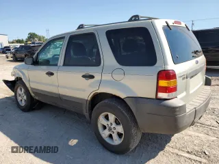 2006 Ford Escape XLT with VIN 1FMCU03116KA69312, listed as a Copart auction lot 70773514 with 164,079 mi miles and Salvage Title. Bid and sale history available at carsss.com. Image 2.