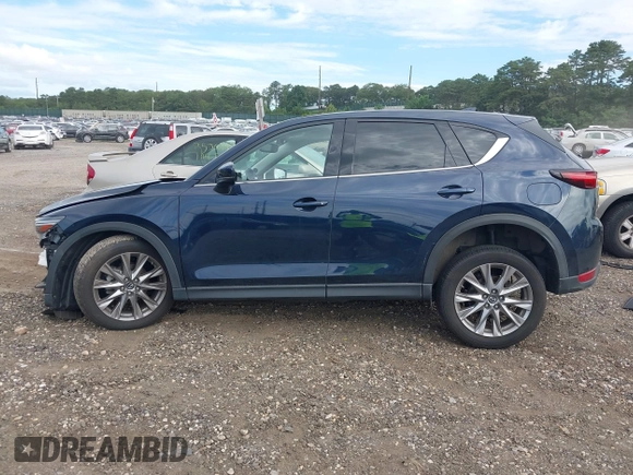2019 Mazda CX-5 Grand Touring with VIN JM3KFBDM8K1521231, listed as a IAAI auction lot 42738963 with 32,179 mi miles and . Bid and sale history available at DreamBid. Image 14.