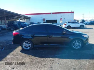 2015 Ford Focus SE with VIN 1FADP3F21FL262033, listed as a IAAI auction lot 41521714 with 101,890 mi miles. Bid and sale history available at carsss.com. Image 13.