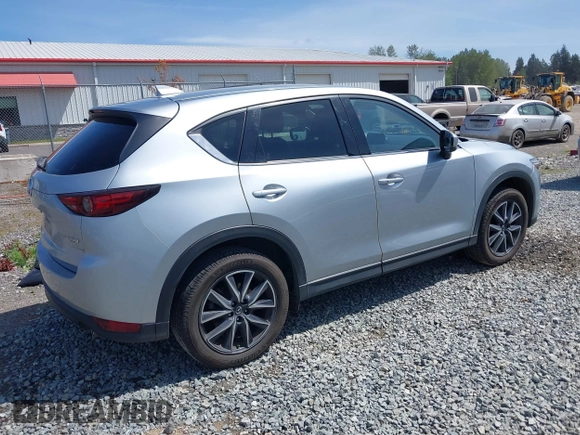 2018 Mazda CX-5 Grand Touring z VIN JM3KFADM7J0318684, wystawiony jako IAAI lot #42226937 z przebiegiem 69 166 mil mil oraz . Historia ofert i sprzedaży dostępna na DreamBid. Obrazek 4.
