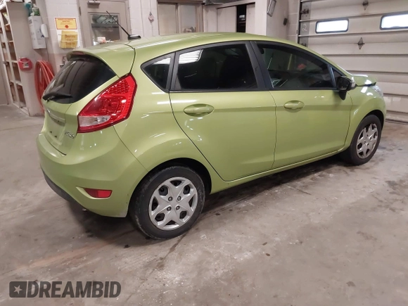 2013 Ford Fiesta SE with VIN 3FADP4EJ9DM131913, listed as a IAAI auction lot 41677333 with 54,673 mi miles. Bid and sale history available at carsss.com. Image 4.