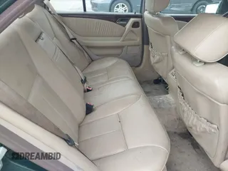 1997 Mercedes-Benz E-Class with VIN WDBJF55F3VJ034009, listed as a IAAI auction lot 41710225 with 239,673 mi miles. Bid and sale history available at carsss.com. Image 8.