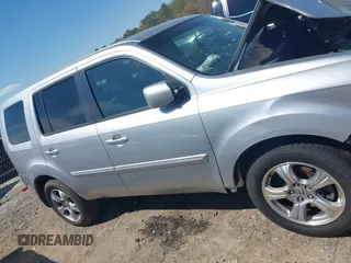 2013 Honda Pilot EX-L with VIN 5FNYF3H59DB022797, listed as a IAAI auction lot 41880675 with 206,359 mi miles and . Bid and sale history available at DreamBid. Image 13.