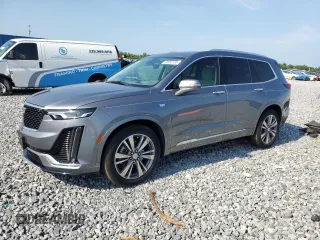 2021 Cadillac XT6 Premium Luxury z VIN 1GYKPCRS5MZ197527, wystawiony jako Copart lot #55952185 z przebiegiem 24 856 mil mil oraz Szkody całkowita. Historia ofert i sprzedaży dostępna na DreamBid. Obrazek 1.