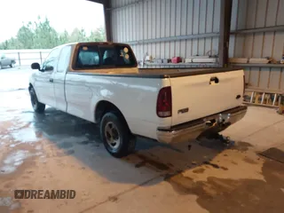 2002 Ford F-150 XL with VIN 1FTRX17L52NA38404, listed as a IAAI auction lot 41871731 with 366,564 mi miles. Bid and sale history available at carsss.com. Image 3.