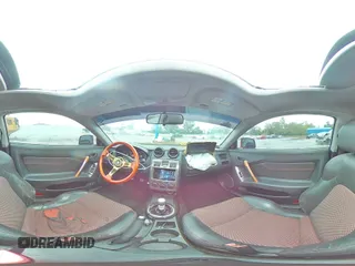 2006 Hyundai Tiburon GT z VIN KMHHN65F66U191134, wystawiony jako Copart lot #56692615 z przebiegiem 197 093 mil mil oraz Szkoda całkowita • Salvage title. Historia ofert i sprzedaży dostępna na DreamBid. Obrazek 15.