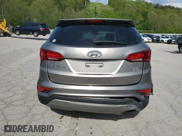 2018 Hyundai Santa Fe 2.4L z VIN 5NMZTDLB9JH079656, wystawiony jako Copart lot #54256175 z przebiegiem 100 678 mil mil oraz Szkoda całkowita • Salvage title. Historia ofert i sprzedaży dostępna na DreamBid. Obrazek 6.