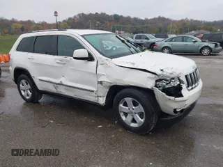 2012 Jeep Grand Cherokee Laredo with VIN 1C4RJFAG6CC297958, listed as a IAAI auction lot 40859811 with 213,499 mi miles. Bid and sale history available at carsss.com. Image 1.