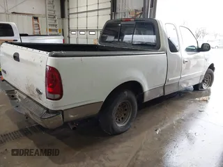 2003 Ford F-150 XL with VIN 1FTRX17W13NB80440, listed as a IAAI auction lot 41460037 with 1 mi miles. Bid and sale history available at carsss.com. Image 4.