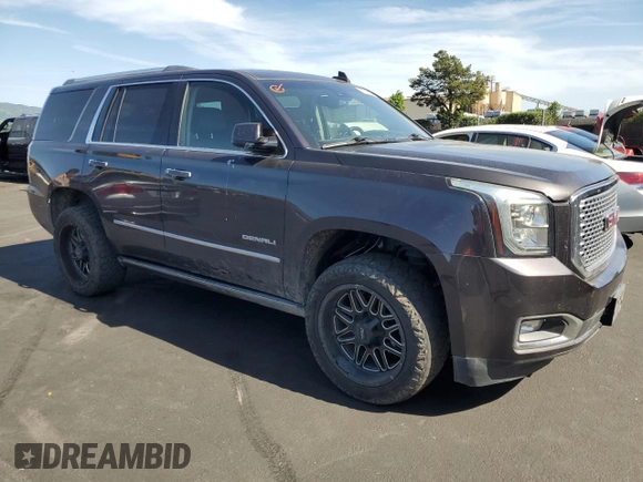 2015 GMC Yukon Denali with VIN 1GKS2CKJ8FR596848, listed as a Copart auction lot 52048105 with 129,935 mi miles and Salvage Title. Bid and sale history available at carsss.com. Image 4.