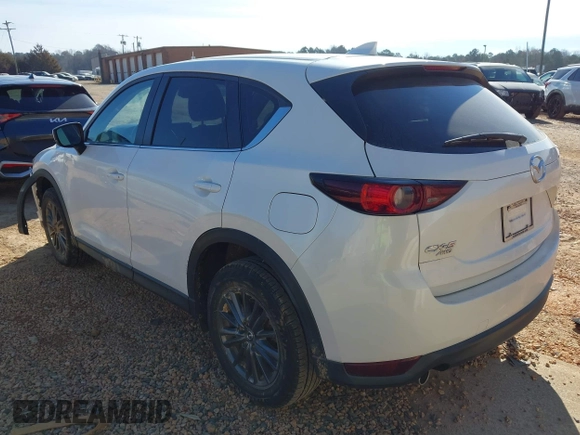 2019 Mazda CX-5 Sport with VIN JM3KFBBM0K0574255, listed as a IAAI auction lot 41661924 with 93,851 mi miles and . Bid and sale history available at DreamBid. Image 3.