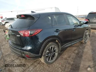 2016 Mazda CX-5 Grand Touring with VIN JM3KE4DY1G0823989, listed as a IAAI auction lot 41770149 with 40,677 mi miles. Bid and sale history available at carsss.com. Image 4.