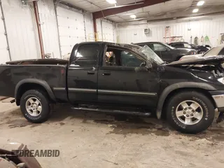 2001 Toyota Tundra SR5 with VIN 5TBRT34131S169696, listed as a IAAI auction lot 41481456 with 215,679 mi miles and . Bid and sale history available at DreamBid. Image 13.