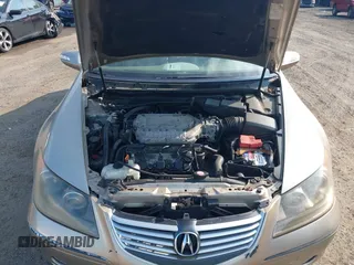 2006 Acura RL z VIN JH4KB16596C005876, wystawiony jako IAAI lot #42666228 z przebiegiem 146 897 mil mil oraz . Historia ofert i sprzedaży dostępna na DreamBid. Obrazek 10.