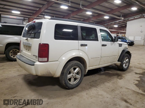2010 Dodge Nitro SXT z VIN 1D4PT5GK8AW158064, wystawiony jako Copart lot #84274974 z przebiegiem 202 668 mil mil oraz Czysty tytuł • Clean title. Historia ofert i sprzedaży dostępna na DreamBid. Obrazek 3.