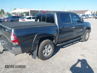 2009 Toyota Tacoma PreRunner with VIN 3TMJU62N59M088137, listed as a IAAI auction lot 41775410 with 217,331 mi miles. Bid and sale history available at carsss.com. Image 4.