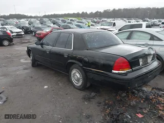 1999 Ford Crown Victoria Police Pkg with VIN 2FAFP71W3XX130521, listed as a IAAI auction lot 41384939 with 257,504 mi miles. Bid and sale history available at carsss.com. Image 3.