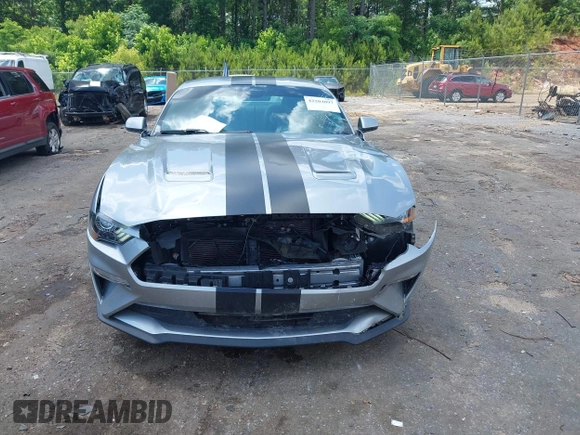 2021 Ford Mustang EcoBoost z VIN 1FA6P8TH1M5121107, wystawiony jako IAAI lot #42204097 z przebiegiem 51 542 mil mil oraz . Historia ofert i sprzedaży dostępna na DreamBid. Obrazek 12.