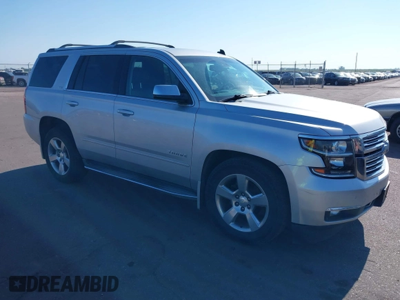 2015 Chevrolet Tahoe LTZ with VIN 1GNSKCKC5FR205739, listed as a IAAI auction lot 40020644 with 142,524 mi miles and . Bid and sale history available at DreamBid. Image 1.