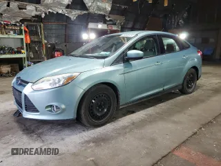 2012 Ford Focus SE with VIN 1FAHP3F27CL149328, listed as a Copart auction lot 56000325 with 147,097 mi miles and Salvage Title. Bid and sale history available at DreamBid. Image 1.