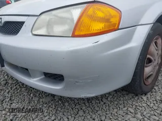 2000 Mazda Protege DX z VIN JM1BJ2225Y0211691, wystawiony jako IAAI lot #42464257 z przebiegiem 176 457 mil mil oraz . Historia ofert i sprzedaży dostępna na DreamBid. Obrazek 6.
